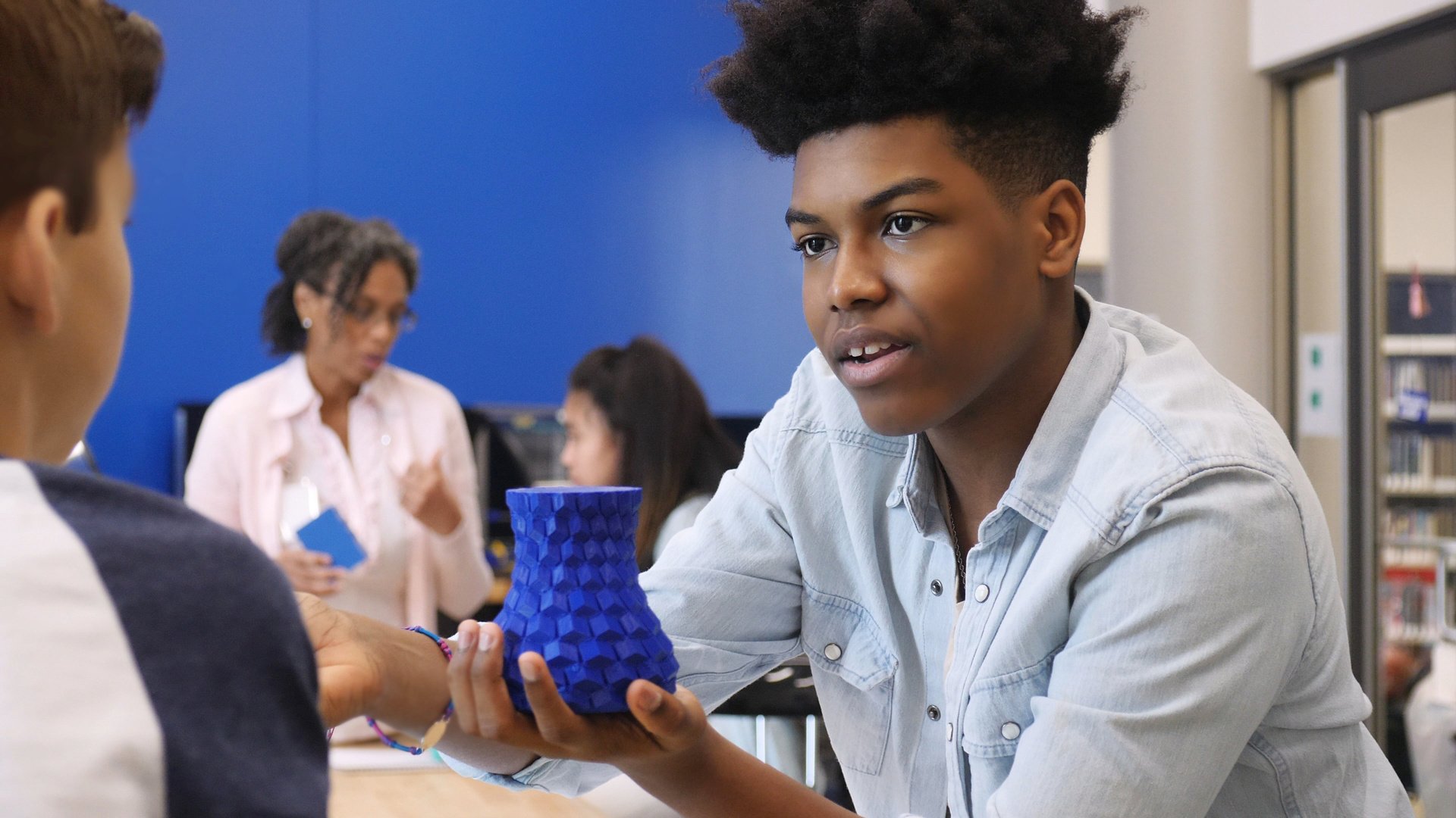 Teen boy mentors elementary student in math